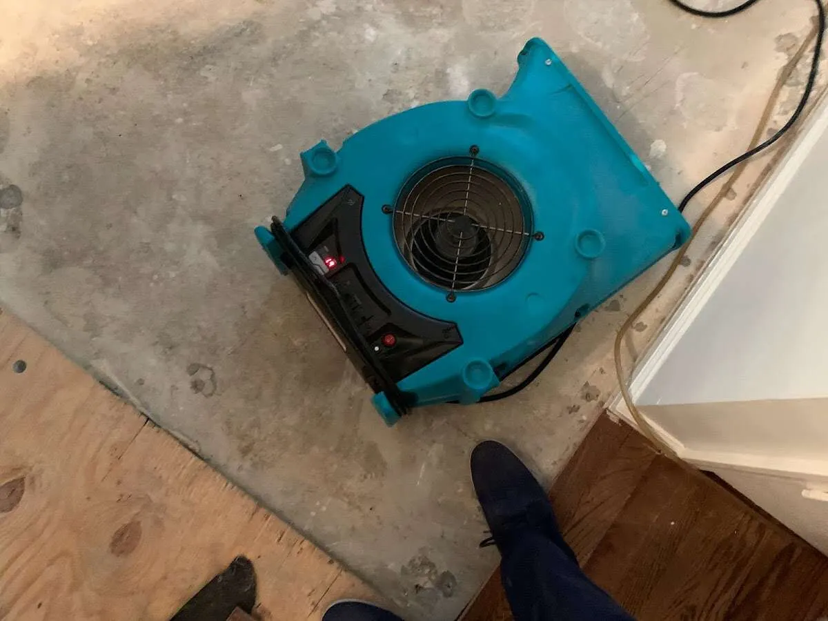 Air mover drying subfloor during Leak Detection & Repair in Schaumburg